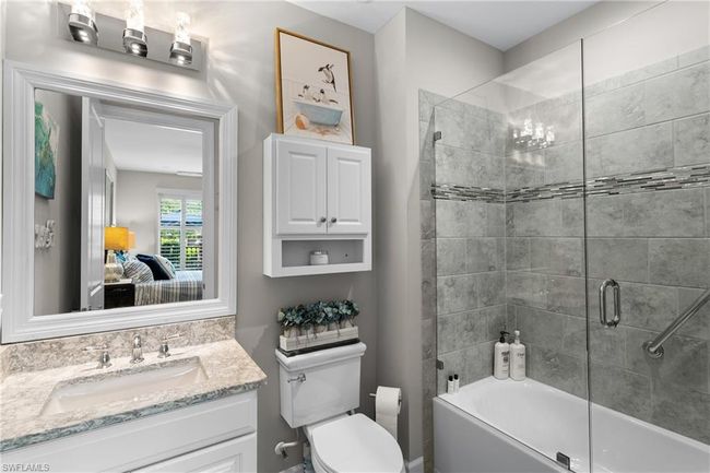 Bathroom with vanity, bathtub / shower combination, and connected bathroom | Image 22