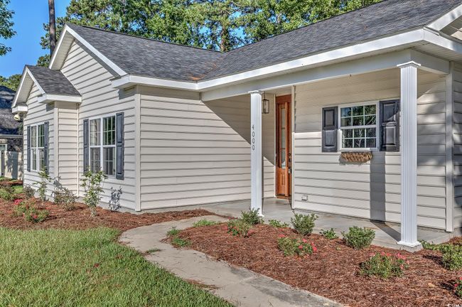 View of front of home with roof with shingles | Image 4