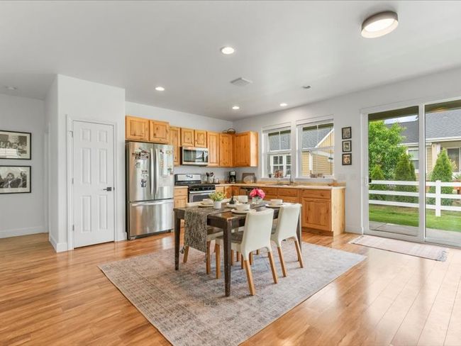 Dining space with light wood-style floors and recessed lighting | Image 13