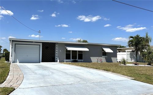 123 Poinsettia Cir Ne, PORT CHARLOTTE, FL, 33952-8236 | Card Image