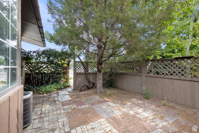 Fenced backyard featuring a patio area | Image 33