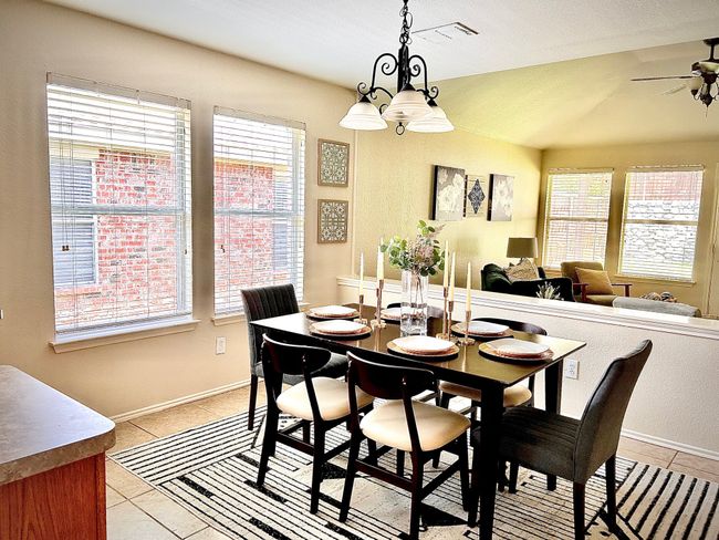 Dining room featuring plenty of natural light and light tile patterned floors | Image 14