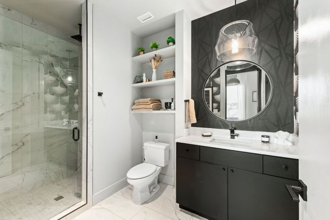 Full bathroom with a marble finish shower | Image 35