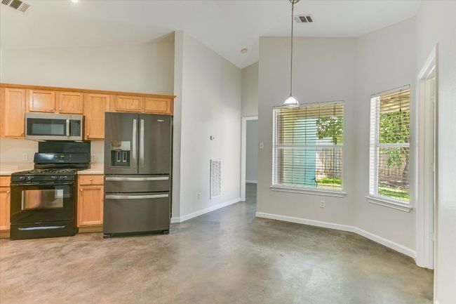 Fresh interior paint throughout the home. Natural light and large dining/breakfast area. | Image 7