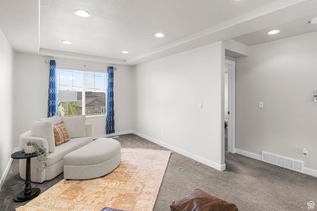 Sitting room with recessed lighting, visible vents, carpet floors, and baseboards | Image 18