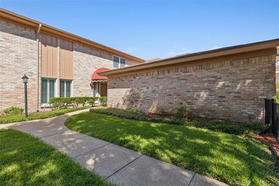 View of property exterior with a yard | Image 3