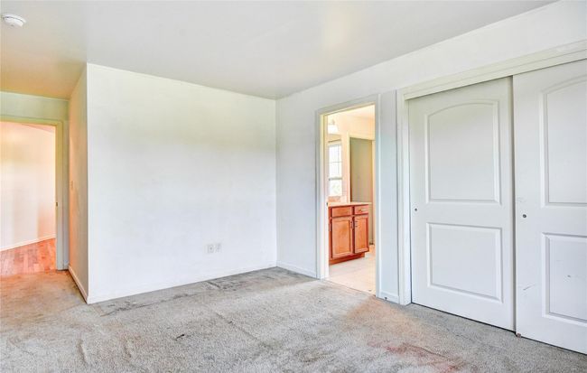 2nd bedroom with light colored carpet, a closet and ensuite bathroom | Image 22