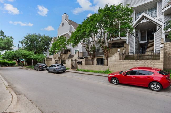 View of asphalt street with curbs and sidewalks | Image 21