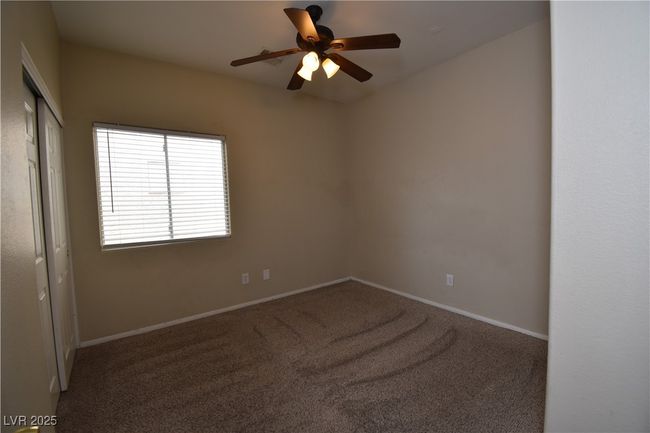 Unfurnished room featuring baseboards, carpet floors, and ceiling fan | Image 17