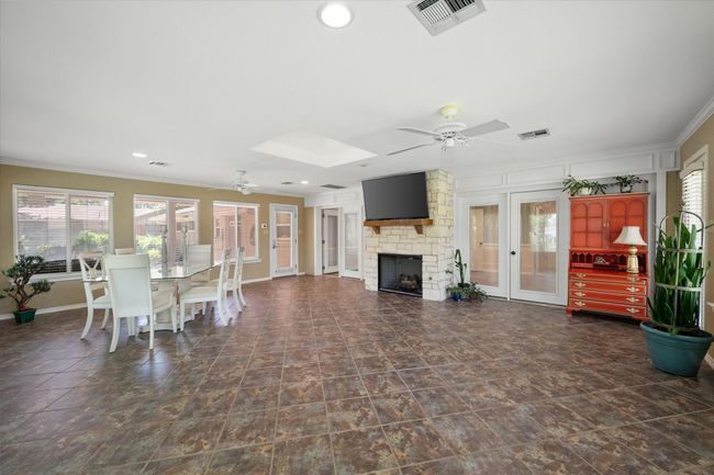 Large open den with stone fireplace | Image 17