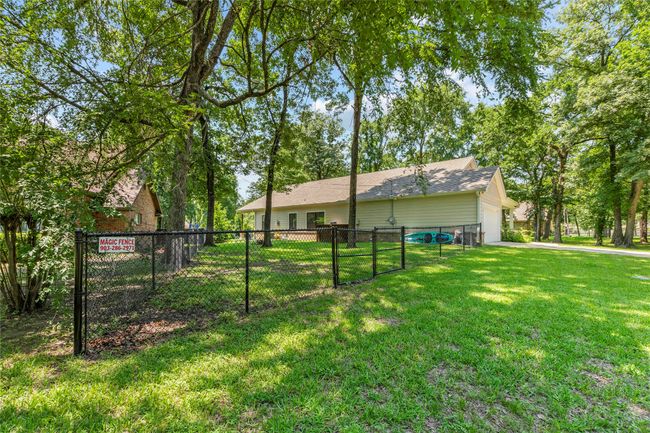 Fenced section perfect for boat storage or pets. | Image 18