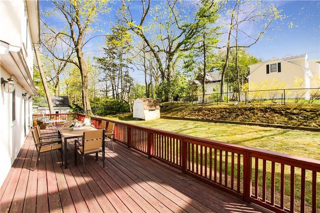 Expansive deck overlooking the fenced in yard. | Image 17