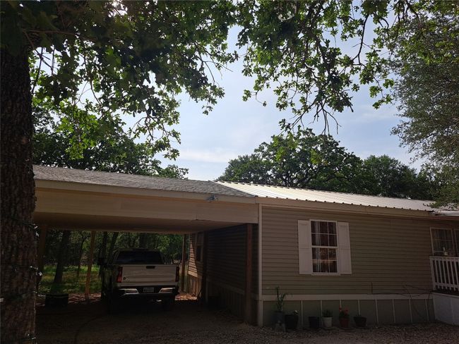 View of car parking featuring a carport | Image 14