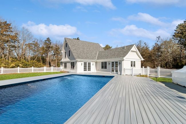 View of pool with a deck and french doors | Image 6