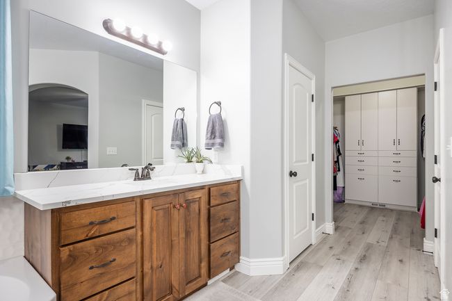 Bathroom featuring vanity and hardwood / wood-style floors | Image 18