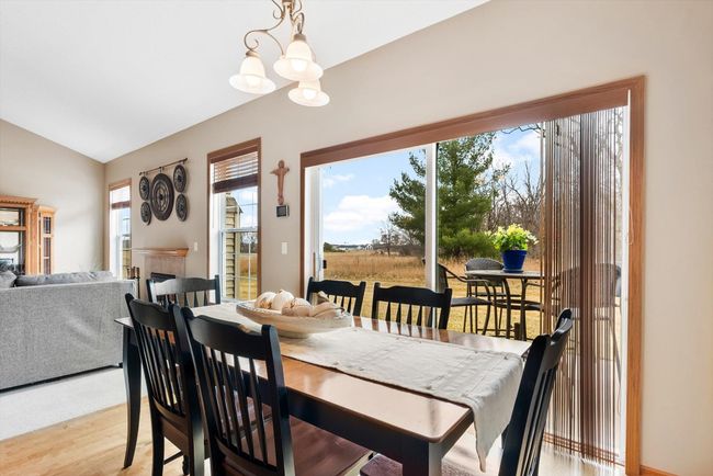 Sliding glass door leads to the backyard patio—bringing in natural light and offering easy access to outdoor living. | Image 18
