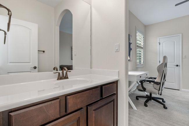 Bathroom featuring vanity and baseboards | Image 24