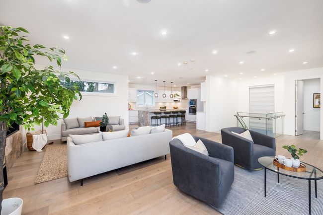 Living room featuring light wood finished floors and recessed lighting | Image 11