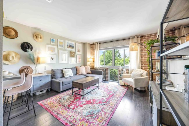 Spacious living area designed for comfortable entertaining and effortless gatherings. | Image 10