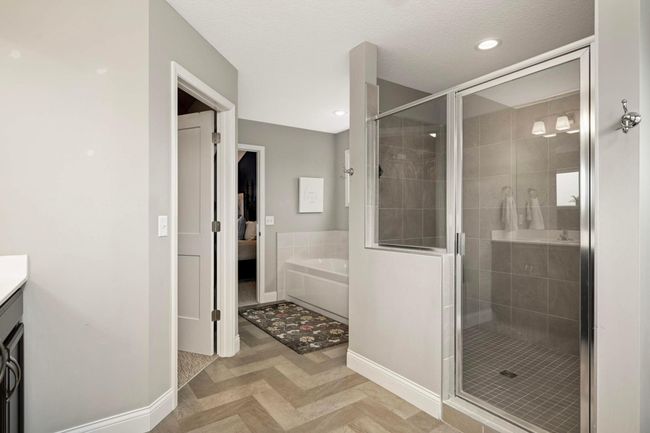 Walk-in tiled shower, separate tub, and huge closet. | Image 29