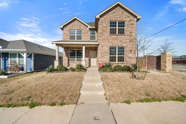 Traditional-style house with covered porch and brick siding | Image 37