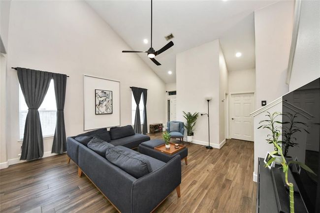 Modern ceiling fan and wood-look tile flooring. | Image 5