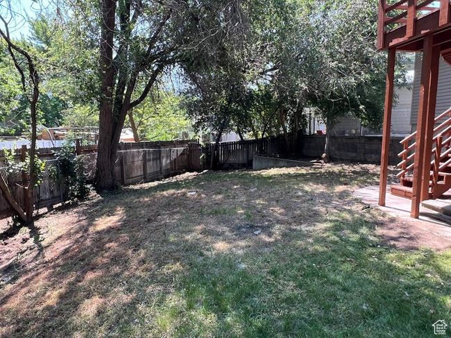 Fenced backyard featuring stairway | Image 32