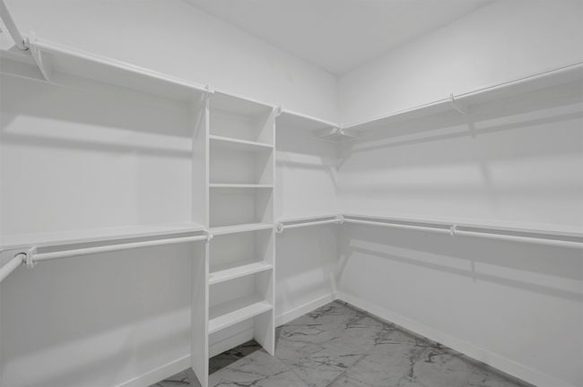 Walk in closet with marble finish floor | Image 19