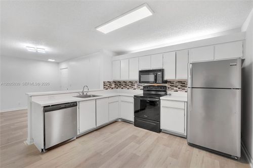 103b7-5661 Riverside Dr, Coral Springs, FL, 33067-2938 | Card Image