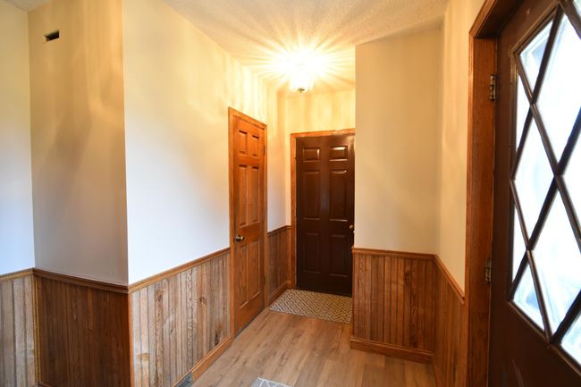 Front entry. Access to pantry and garage | Image 5