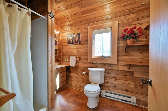 The guesthouse also has electric baseboard heat. | Image 76