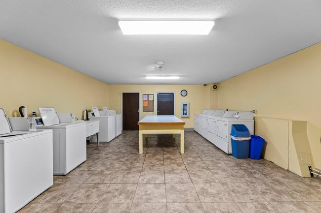 Spacious and clean laundry room | Image 20