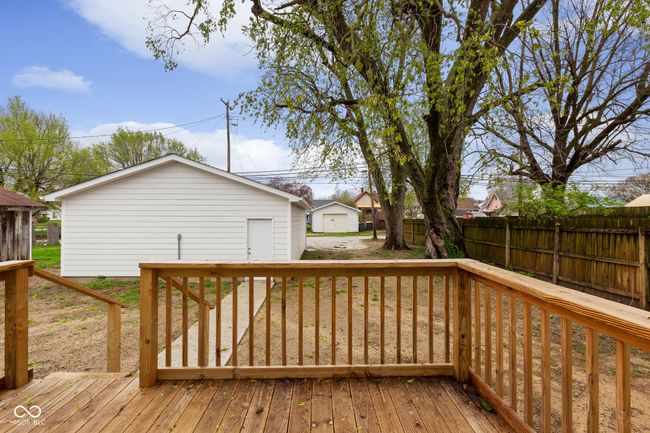 deck featuring fence and an outdoor structure | Image 7