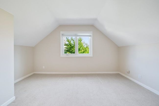 Bonus room with baseboards, vaulted ceiling, and light carpet | Image 28