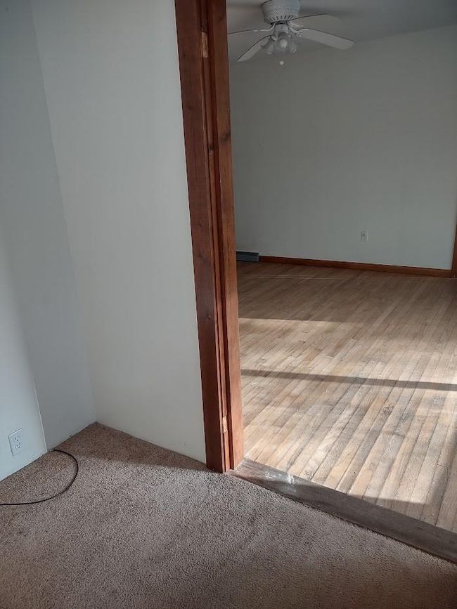 Carpeted spare room with ceiling fan | Image 16