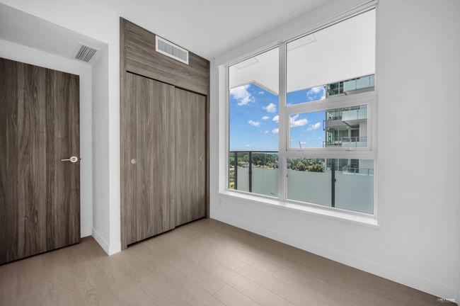 Unfurnished bedroom featuring light wood-type flooring and a closet | Image 15