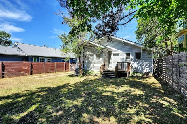 Rear view of house featuring a wooden deck | Image 14