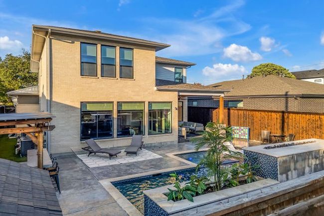 Rear view of house with a patio area | Image 38
