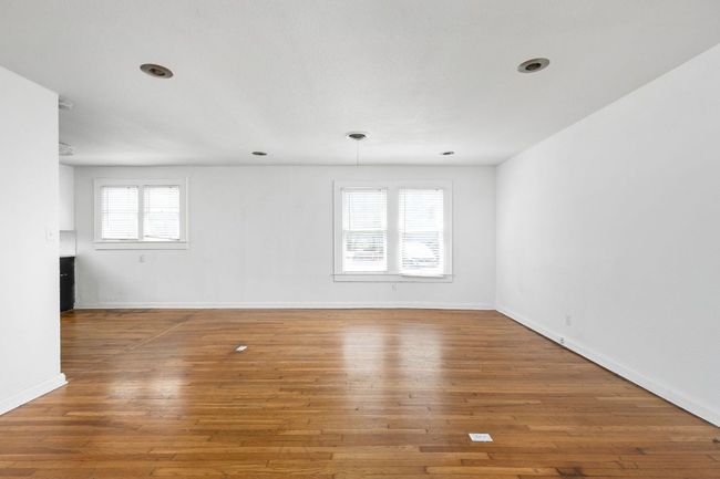 Empty room featuring hardwood / wood-style flooring and baseboards | Image 31