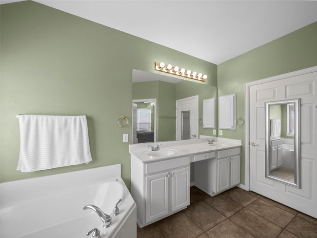Full bathroom with tile patterned floors, a garden tub, a sink, and double​​‌​​​​‌​​‌‌​‌‌​​​‌‌​​‌‌​‌​​​​​‌ vanity | Image 22