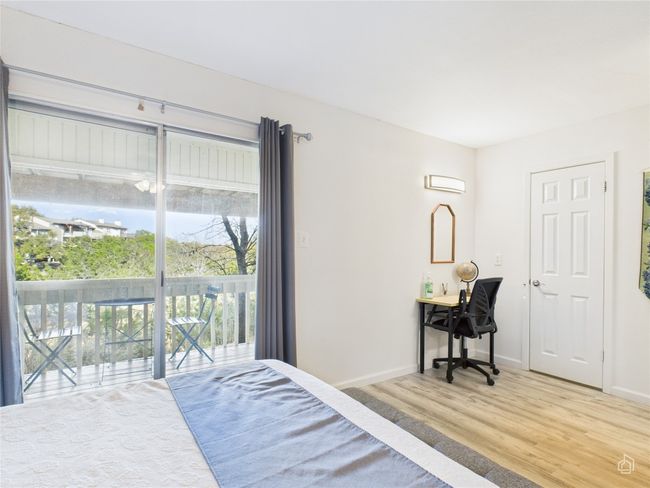 Bedroom with access to outside. Lots of natural light. | Image 19