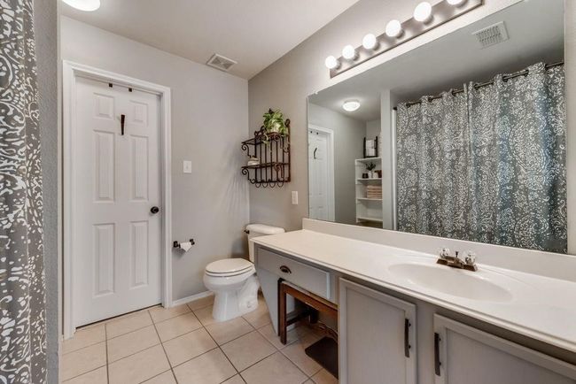 Bathroom with tile patterned floors and vanity | Image 21