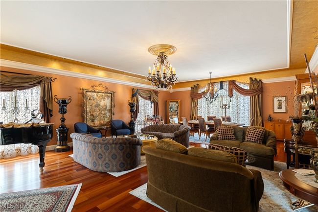 This photo shows the size of the large great room and what is spectacular about this room is the owners have incorporated a large dining area. It flows perfectly for entertaining. | Image 18