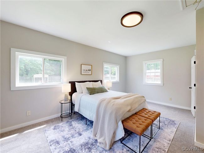 First Floor Primary Bedroom with walk in closet and full bathroom | Image 21