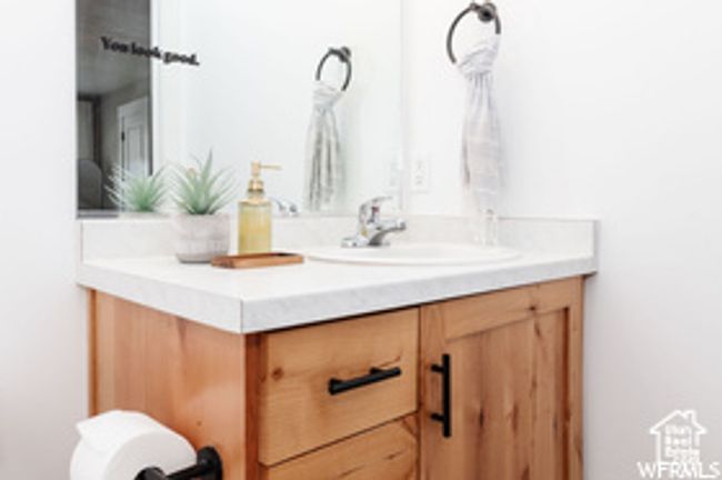 Bathroom featuring vanity | Image 8