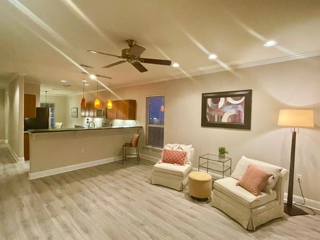 Sitting room featuring crown molding, light wood-style floors, a ceiling fan, and recessed lighting | Image 6