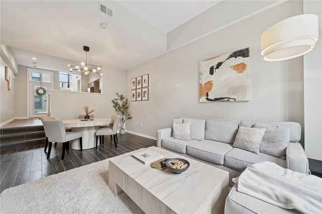 This space also encompasses the dining area. | Image 6