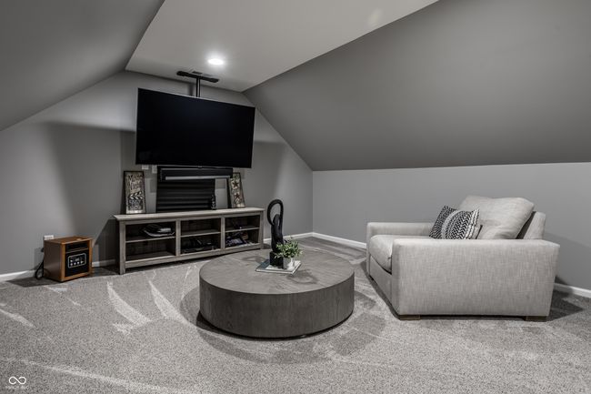 BONUS room featuring baseboards, carpet, and lofted ceiling | Image 49