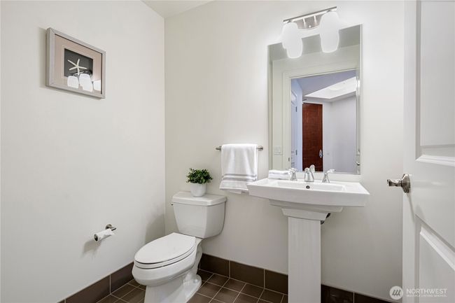 Sophisticated half bath designed for guests. | Image 11
