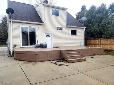 Back of house featuring a wooden deck, a patio area | Image 2